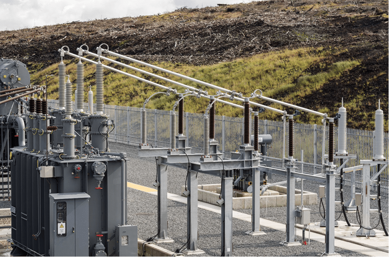 Electrical substation with hill in background