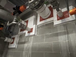 Overhead conduit going through wall