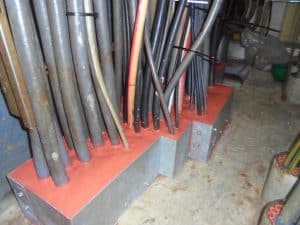 Pipes going through sealing into floor