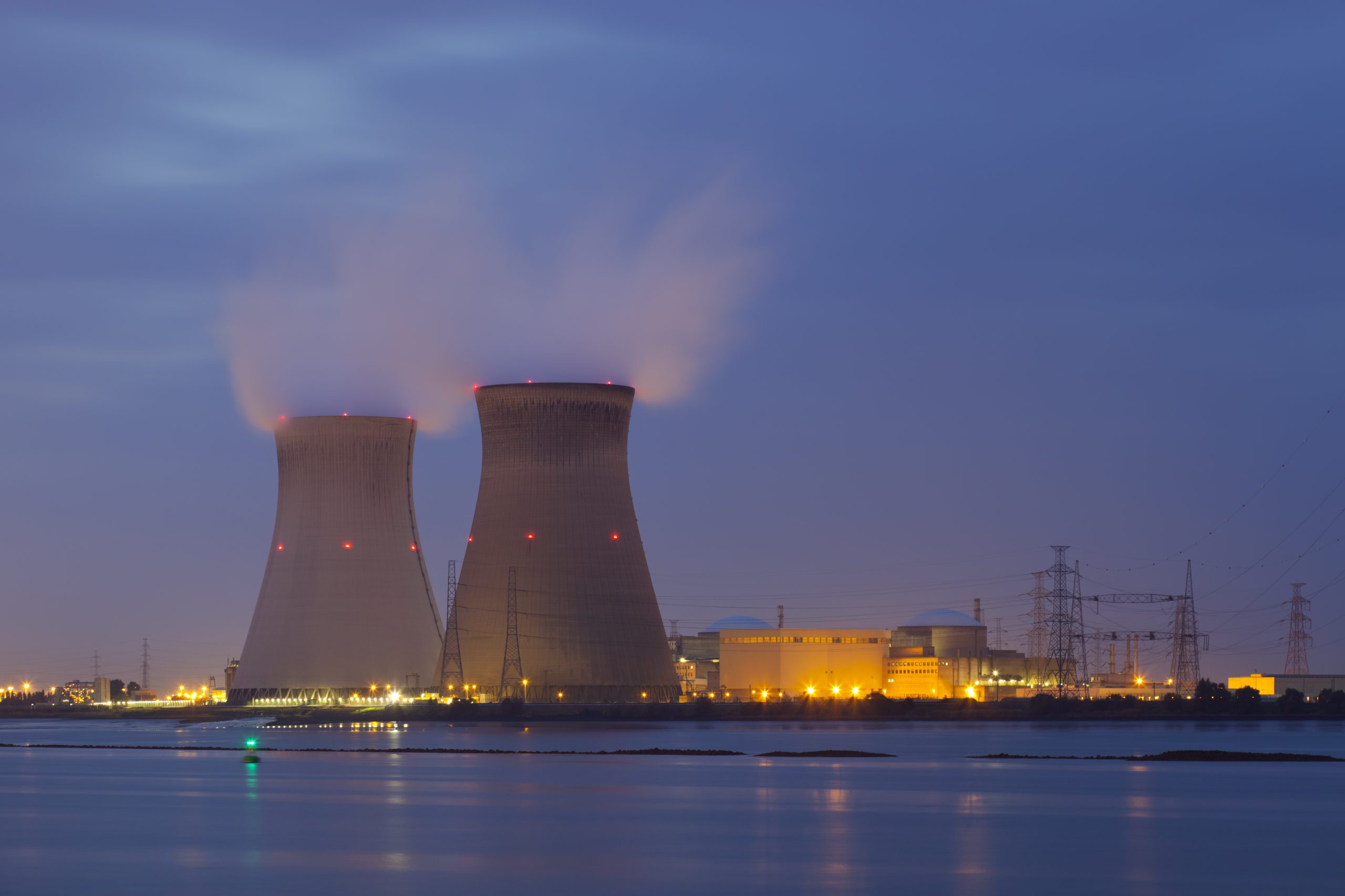 Nuclear power plant Doel in Belgium with night blue sky.