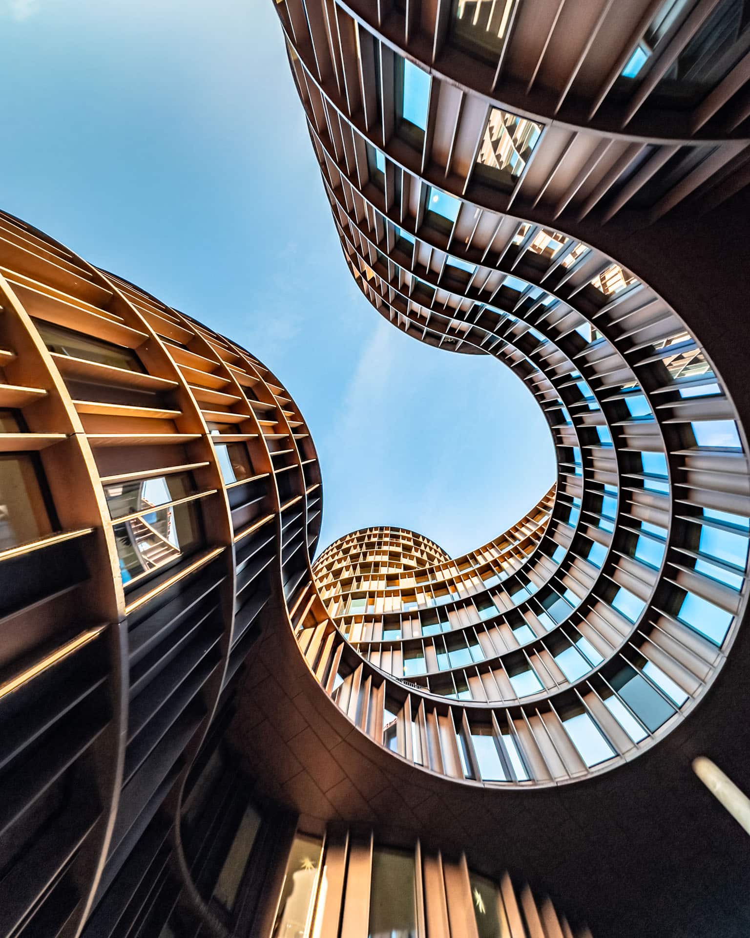 Looking up at curved modern building