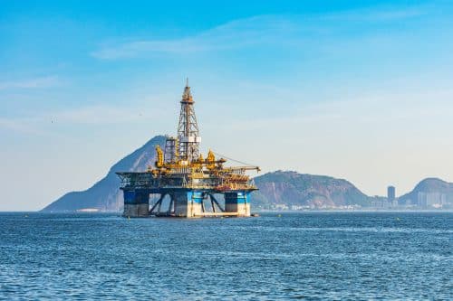 Oil drilling platform moving at sea