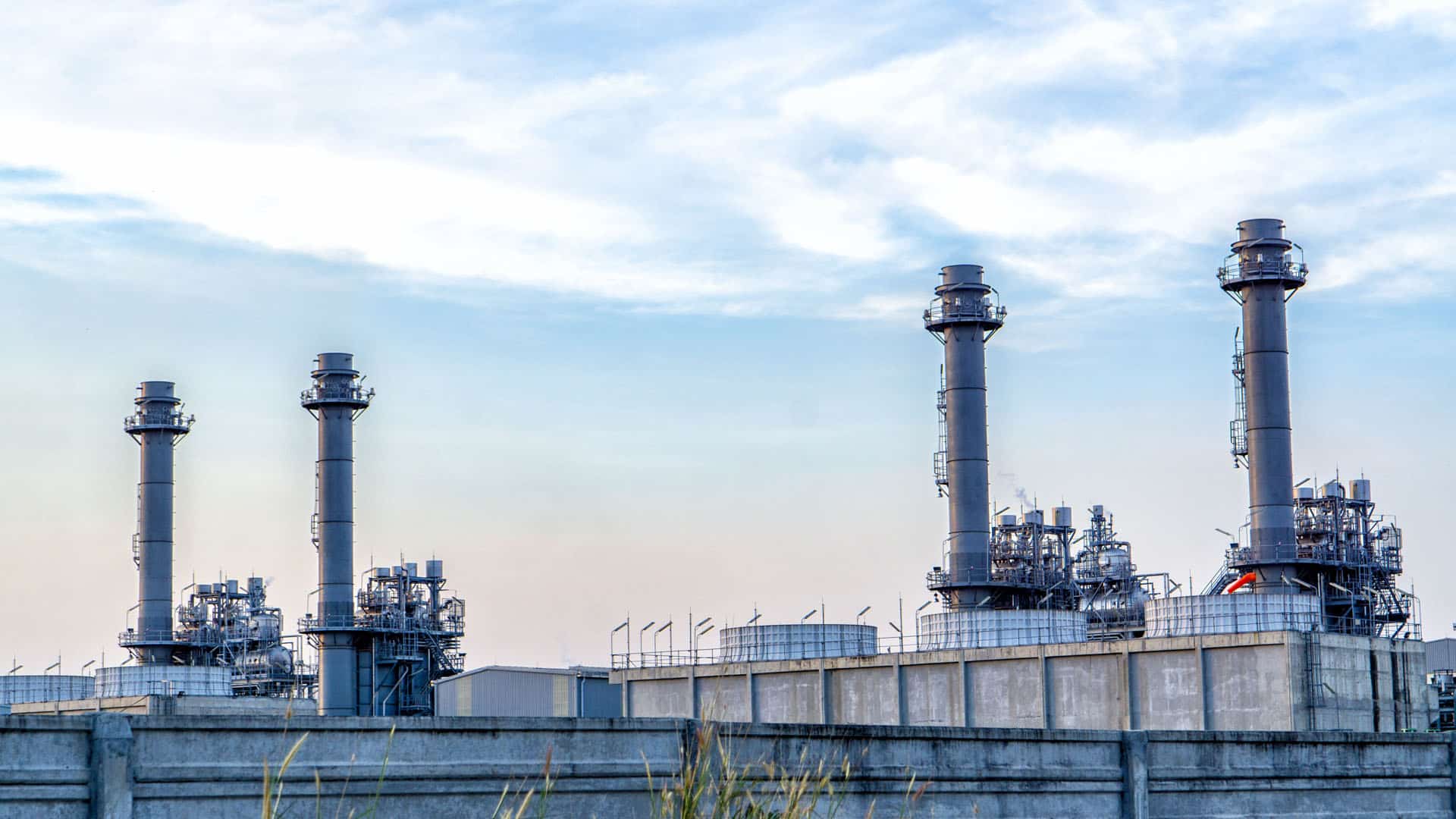 Towers of a chemical plant against a blue sky