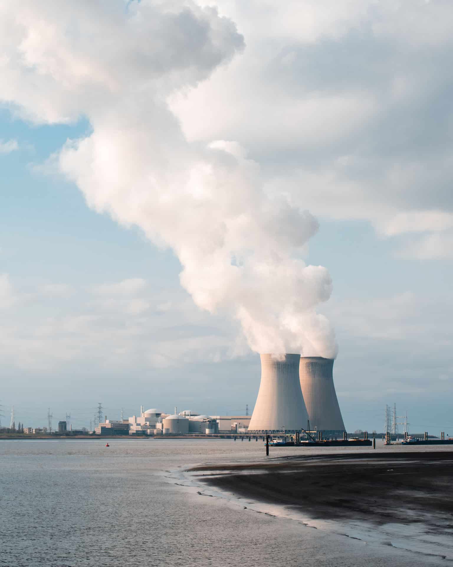 Two cooling towers of a nuclear plant producing steam
