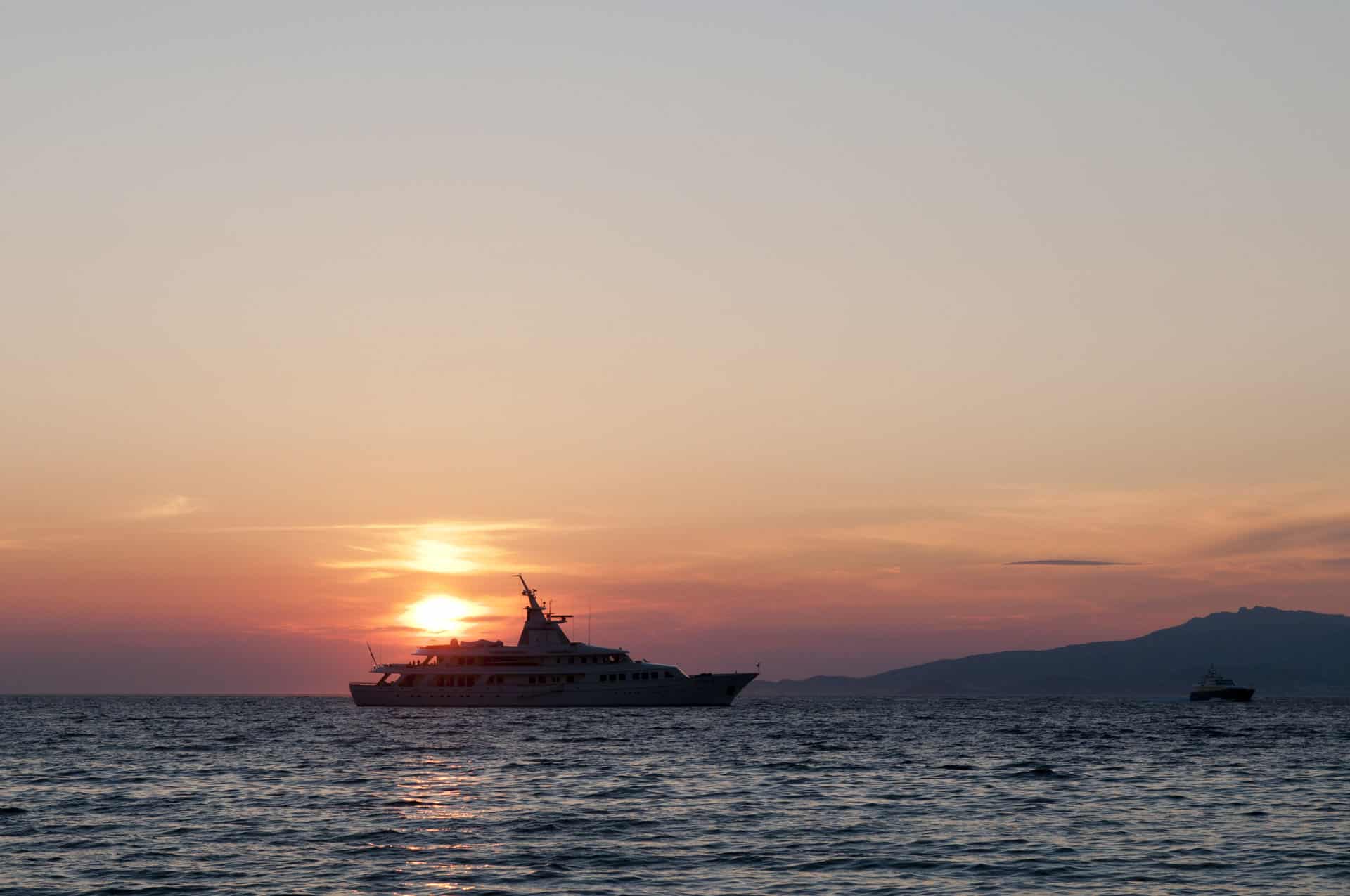 Silhouette of luxury yacht at sunset